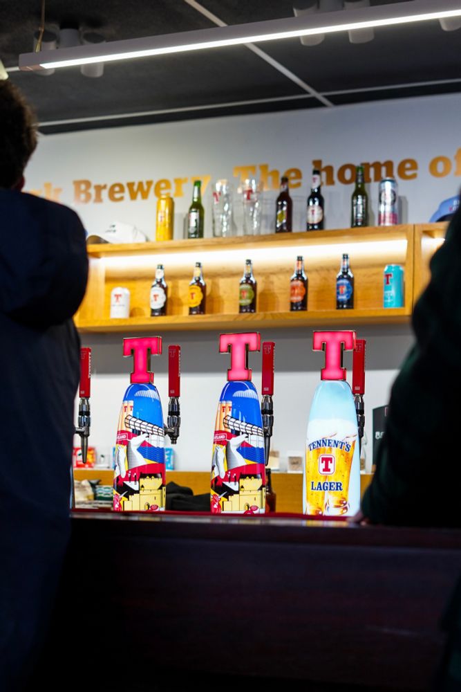 Three Tennent’s big red ‘T’ keg lines in the brewery bar