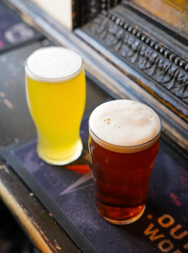 Pint of Harvey’s Sussex Best with a yellow pint of Siren