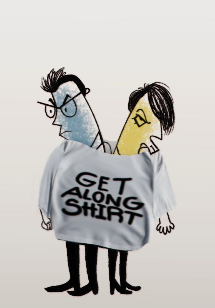 Flansburgh and Linnell pouting angrily, stuck together in the same oversized shirt, which reads "Get Along Shirt".