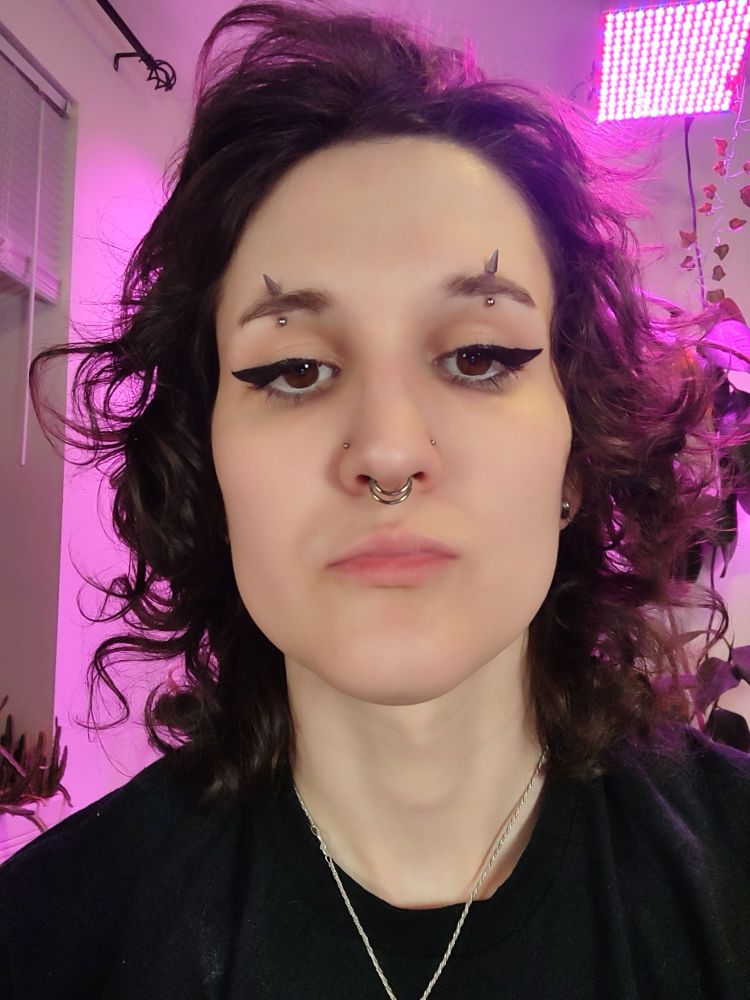 A stupid selfie of yours truly so I can show off my facial piercings and eyeliner 