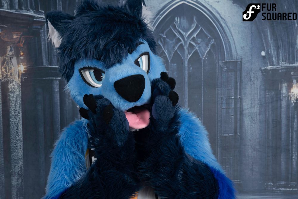 me in my full fursuit with my paws on my muzzle, making a cute pose
