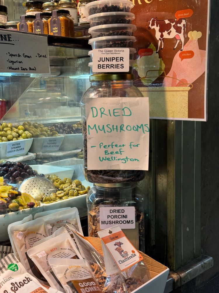 Market store with a big jar with the label ‘dried mushrooms - perfect for beef Wellington’