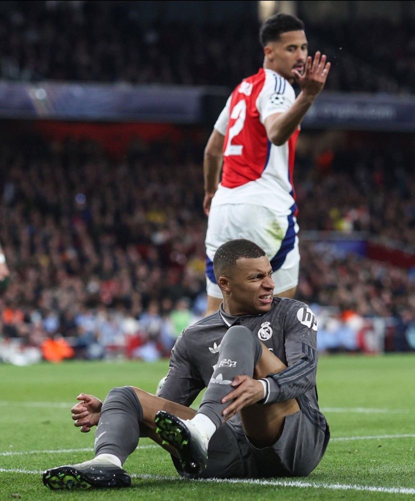 William Saliba motioning to Mbappe to get up during the first leg of the ucl quarter finals 