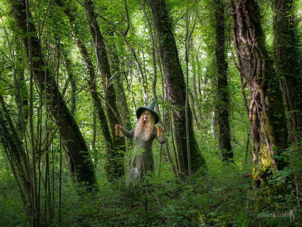 Singer Priscilla Hernandez in the forest  dressed like a witch