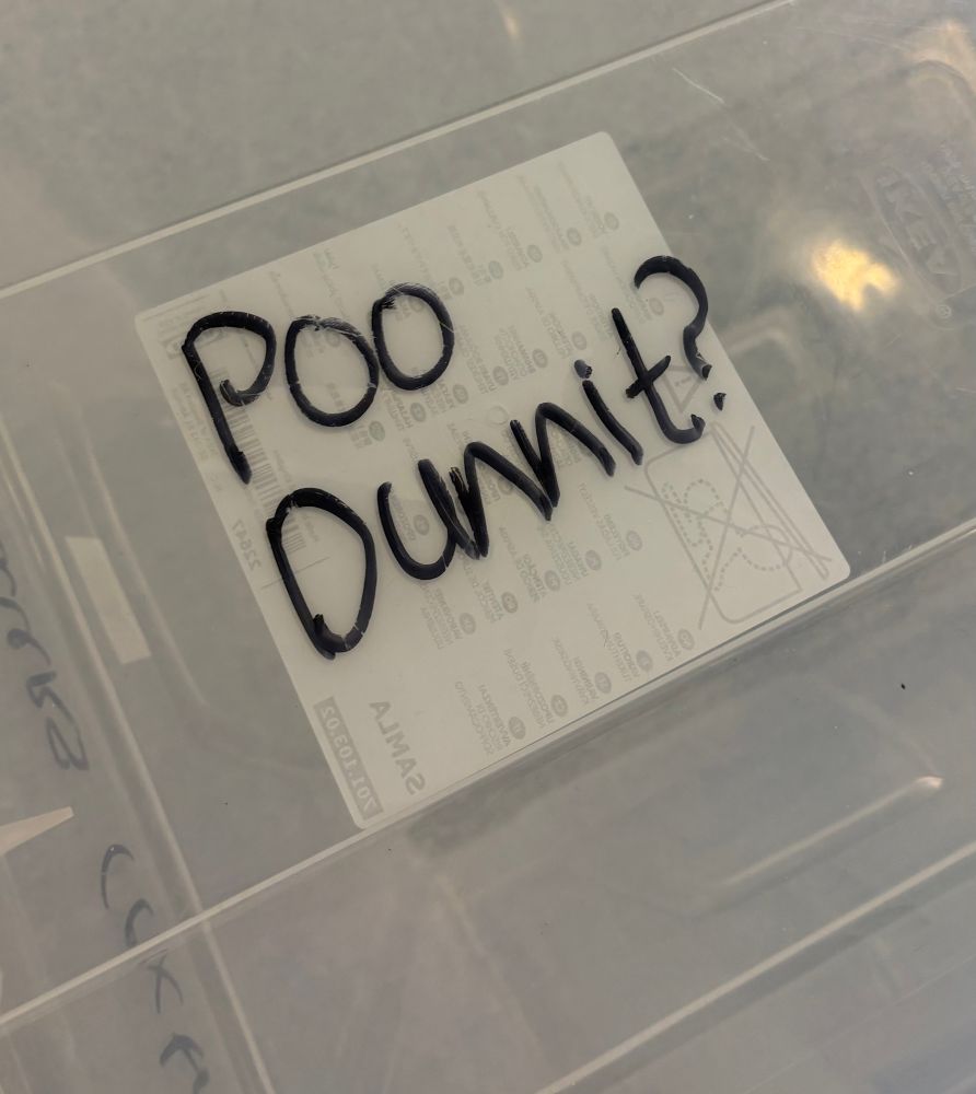 Plastic box with ‘Poo Dunnit’ written on it