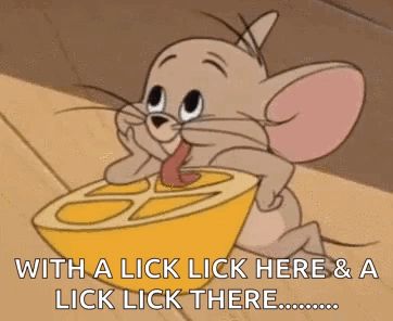 a cartoon mouse is licking a lemon slice .