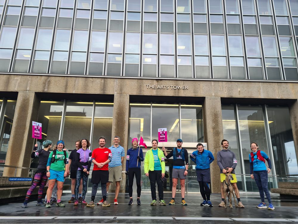 A picket line outside a university building. 