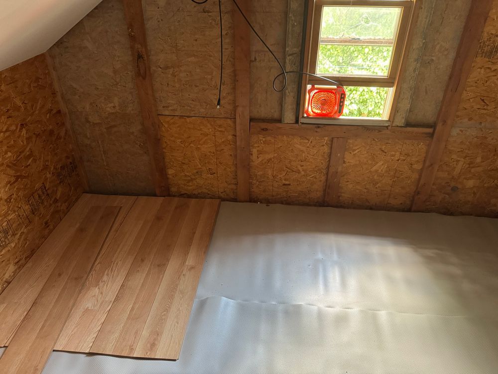 Starting to lay flooring in the attic garage shack.
