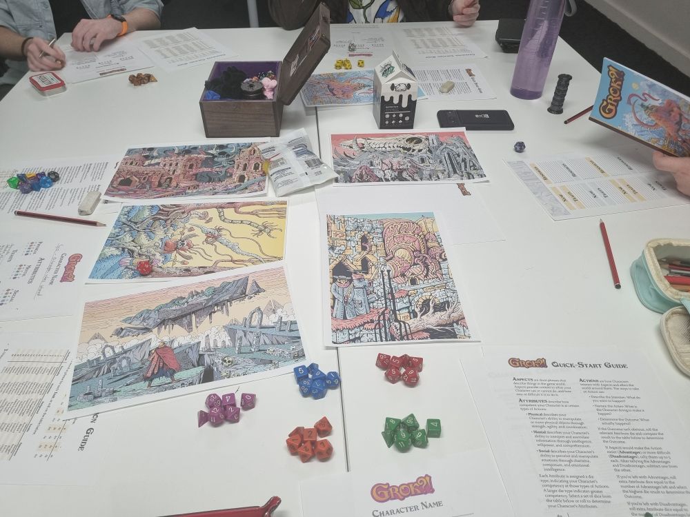 Our TTRPG table with some dice and printouts of the art from the game Grok from our game table.  
