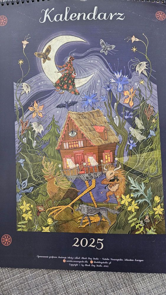 The front of a 2025 calendar in Polish, featuring artwork of Baba Yaga's chicken-legged hut.