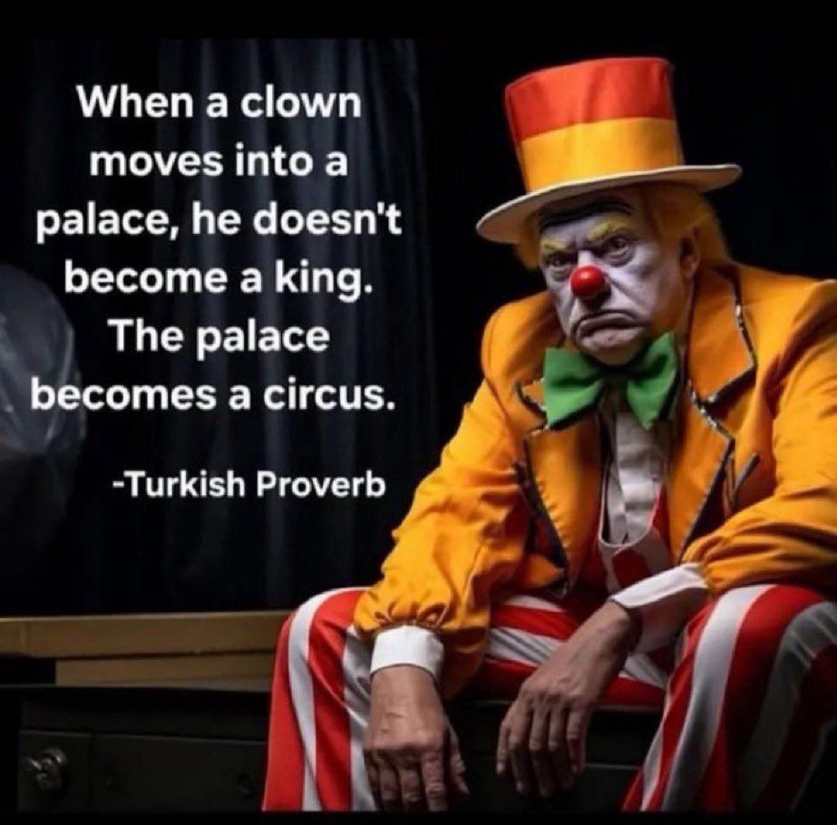 The image is a digitally altered depiction of Donald Trump dressed as a clown. He is sitting on a bench with a serious, almost grumpy expression. His outfit is flamboyant, featuring a bright orange jacket with black trim, a green bow tie, a red-and-yellow top hat, and red-and-white striped pants. His face is painted white, with exaggerated eyebrows, yellow makeup around his eyes, and a signature red clown nose.

Overlaying the image is a quote attributed to a Turkish proverb:
“When a clown moves into a palace, he doesn’t become a king. The palace becomes a circus.”

The combination of the altered image and the quote is a direct critique of Trump’s presidency, implying that rather than rising to the dignity of the office, he turned it into a spectacle. The dark background contrasts sharply with the bright clown costume, reinforcing the satirical and critical tone of the image.