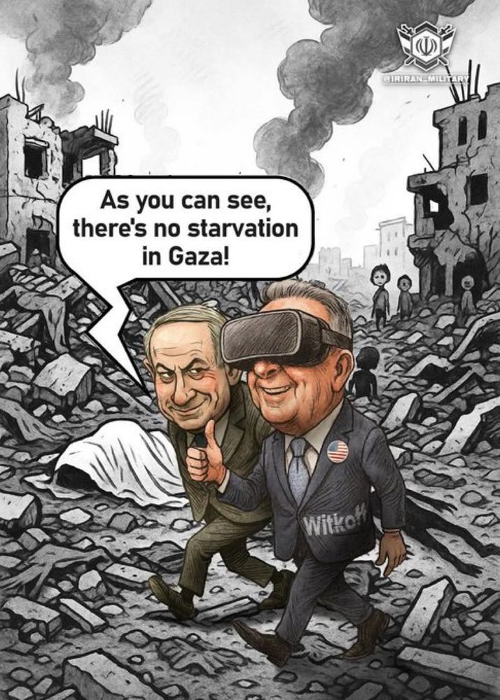 A political cartoon illustration depicting a war-torn, rubble-strewn landscape resembling Gaza, with destroyed buildings, smoke rising in the background, and small distant figures amid the debris. In the foreground, an older man resembling Benjamin Netanyahu, dressed in a dark suit, walks while pointing forward and speaking via a speech bubble that reads, “As you can see, there’s no starvation in Gaza.” He is guiding a smiling man resembling Steve Witkoff, Trump’s recent emissary to the region, who wears a dark suit with an American flag pin, VR headset over his eyes, and a name tag reading “Witkof.” A body covered in a white sheet lies on the ground to their left. The image is mostly grayscale with muted colors on the suits, composed to satirize denial of humanitarian crises, with a small logo in the top right corner. 0 2 7 
