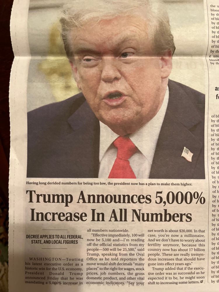 Photo of a print article from The Onion. Headline reads: Trump Announces 5,000 Increase in All Numbers.