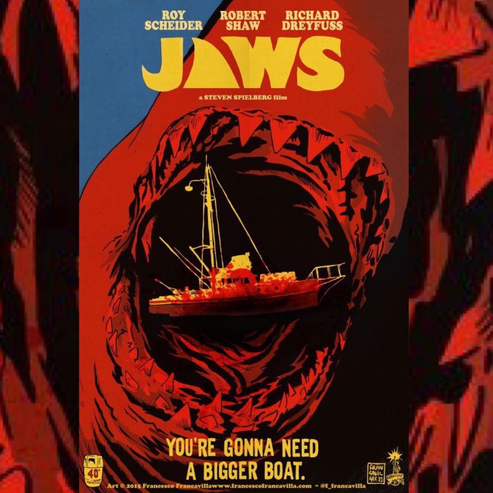 My poster for JAWS showing a closeup of the shark's open mouth with the rows of teeth and a bloody silhouette of the Orca (the fishing boat in the movie) over imposed to the open mouth.