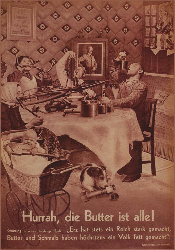 German artist John Heartfield’s photomontage “Hurrah, die Butter ist alle” shows a German family at a dinner table eating a bicycle, where a nearby portrait of Hitler hangs and the wallpaper is emblazoned with swastikas. The baby gnaws on an executioner’s axe, also emblazoned with a swastika, and the dog licks a huge nut and bolt. Below, the title is written in large letters, in addition to a quote by Hermann Göring during food shortage. Translated, the quote reads: “Hooray, the butter is all gone!” Göring said in one Hamburg address: “Iron ore has made the Reich strong. Butter and dripping have, at most, made the people fat”.

(Description cribbed from https://theincubator.live/2016/12/17/john-heartfield-hurrah-die-butter-ist-alle-1935/)