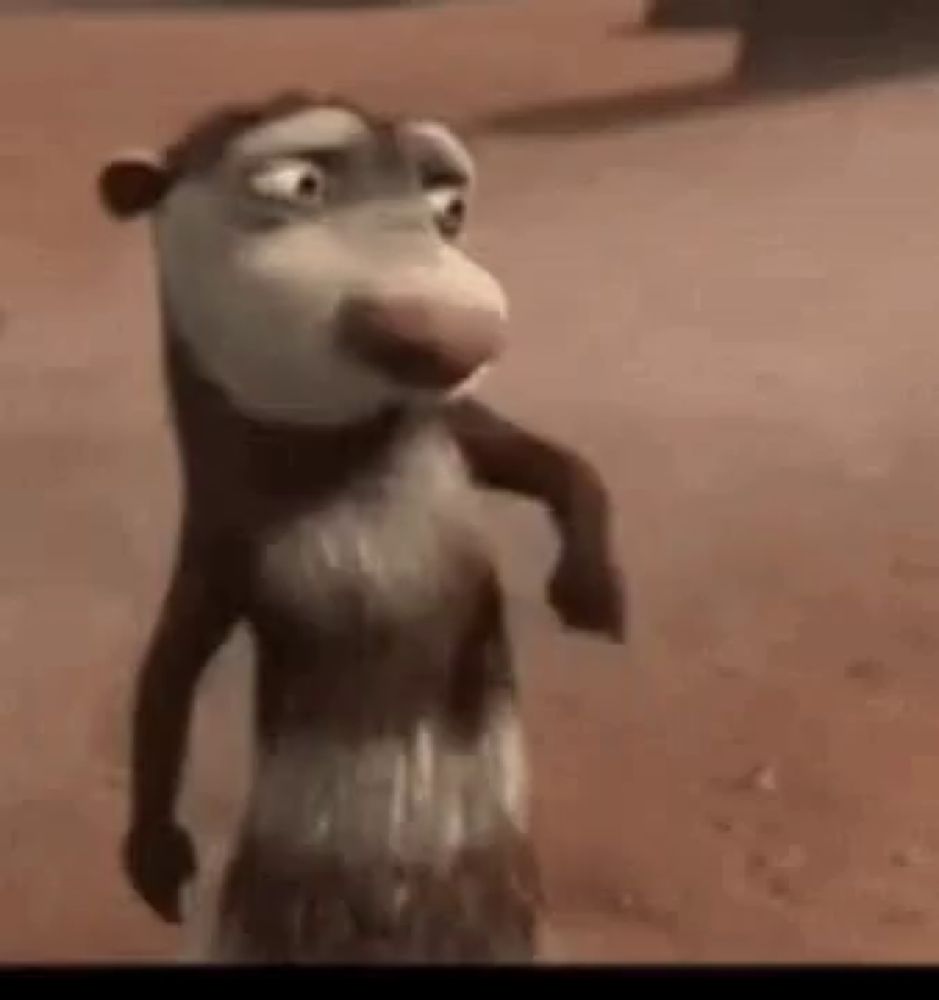 a cartoon opossum is standing on its hind legs on a sandy beach .