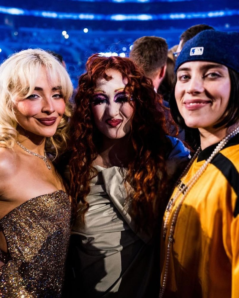 chappell roan, sabrina carpenter, and billie eilish pose together at the grammys