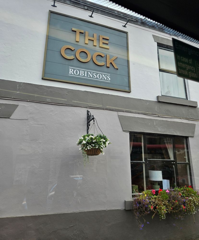 A pub sign for The Cock.

I am a child.