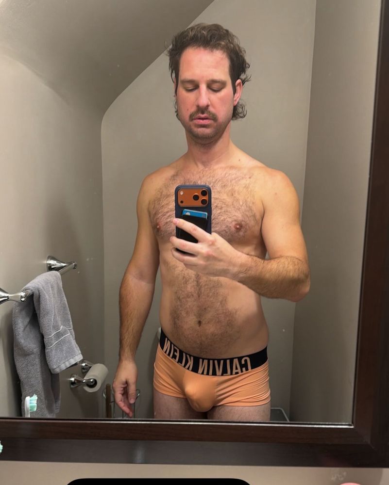 Man doing selfie in bathroom