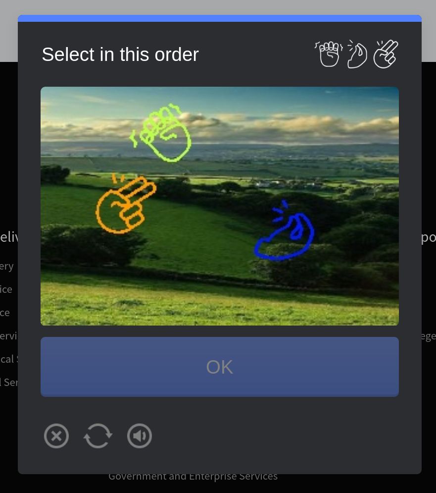 a CAPTCHA. this is a picture of rolling green countryside. over it are floating three differently-coloured icons showing various hand positions, all of which are uh, gestures one might use during sexual acts. you're supposed to select them in order