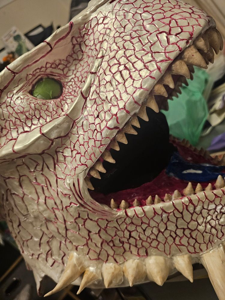 A closer look at the teeth and mouth where the teeth are painted in a slightly dirty off white with a darker base to look like bone