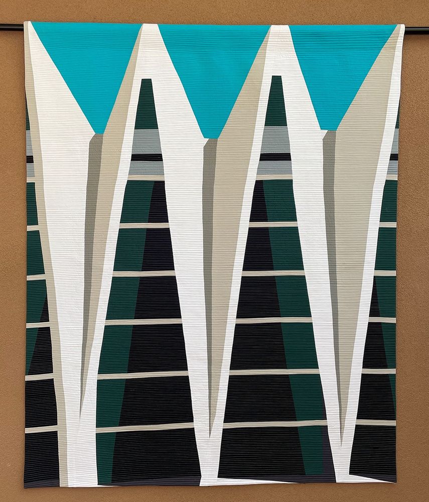A quilt of mine resembling a gymnasium with tall triangle-shaped windows