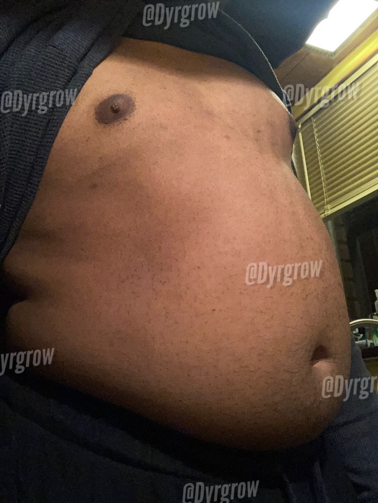 One bloated belly bathed in yellow kitchen sink overhead lighting coming right up!