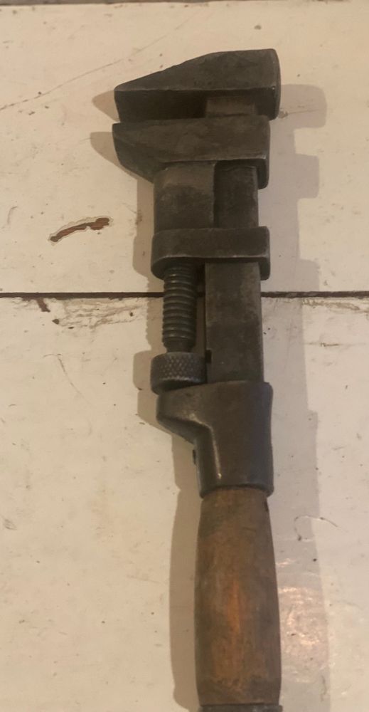 Photo I found on Etsy of a nearly identical wrench in a complete state