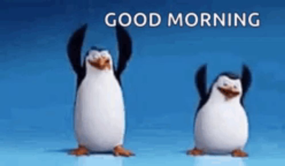 two penguins are dancing with their arms in the air and the words good morning are above them .