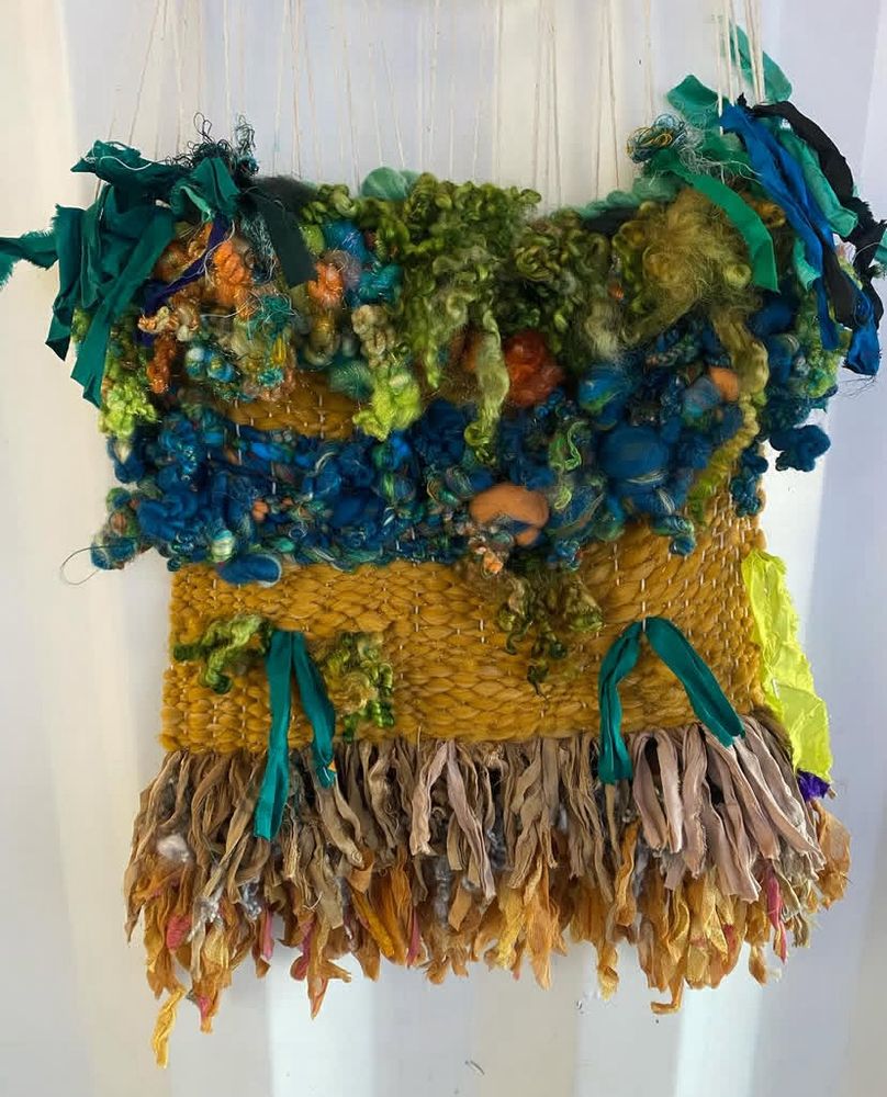 Original weaving using handspun yarns and recycled textiles. Colors: yellow, blue, green, brown 