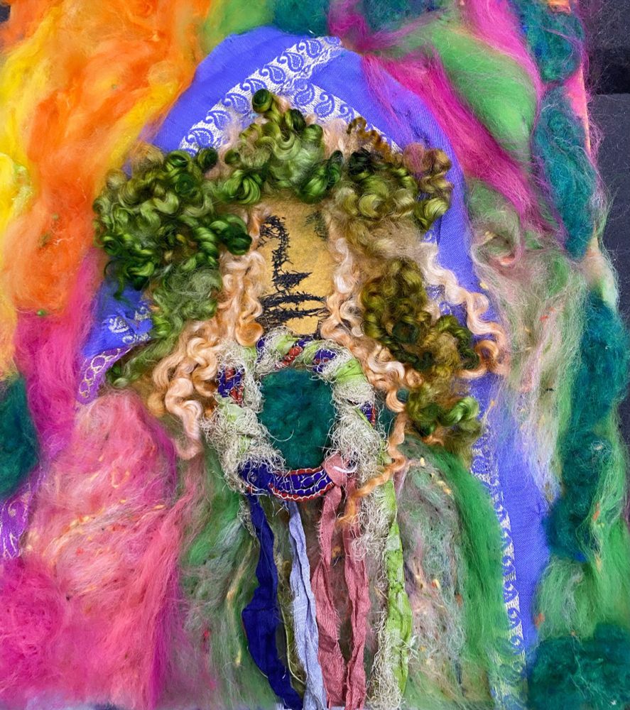 Embroidery and felting, colors from Aurora Borealis, fibers of silk, mohair, and wool