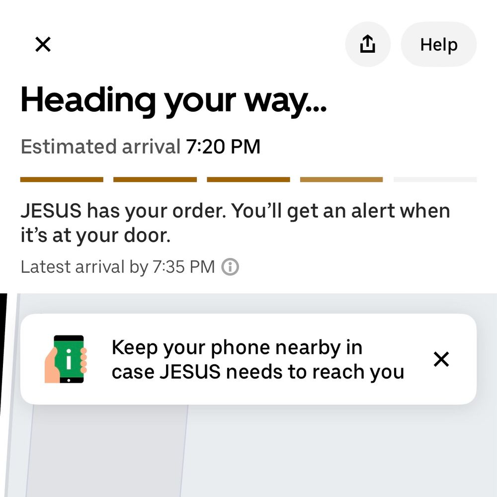 Screenshot of the Uber Eats app tracking an order with the title “Heading your way…” and the text “JESUS has your order. You’ll get an alert when it’s at your door.” Below that text is a tracking map that is mostly cropped out of view.