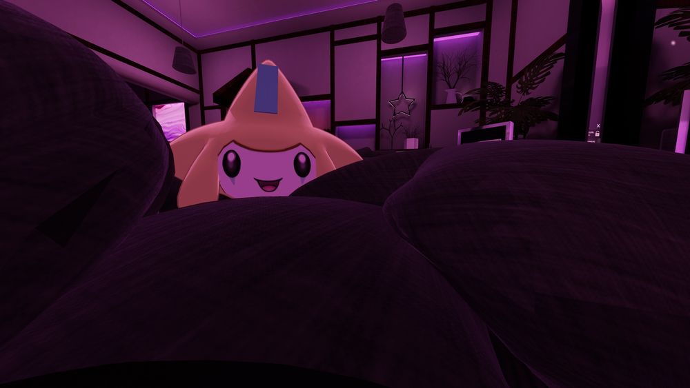 Jirachi hiding in a set of pillows in vrchat