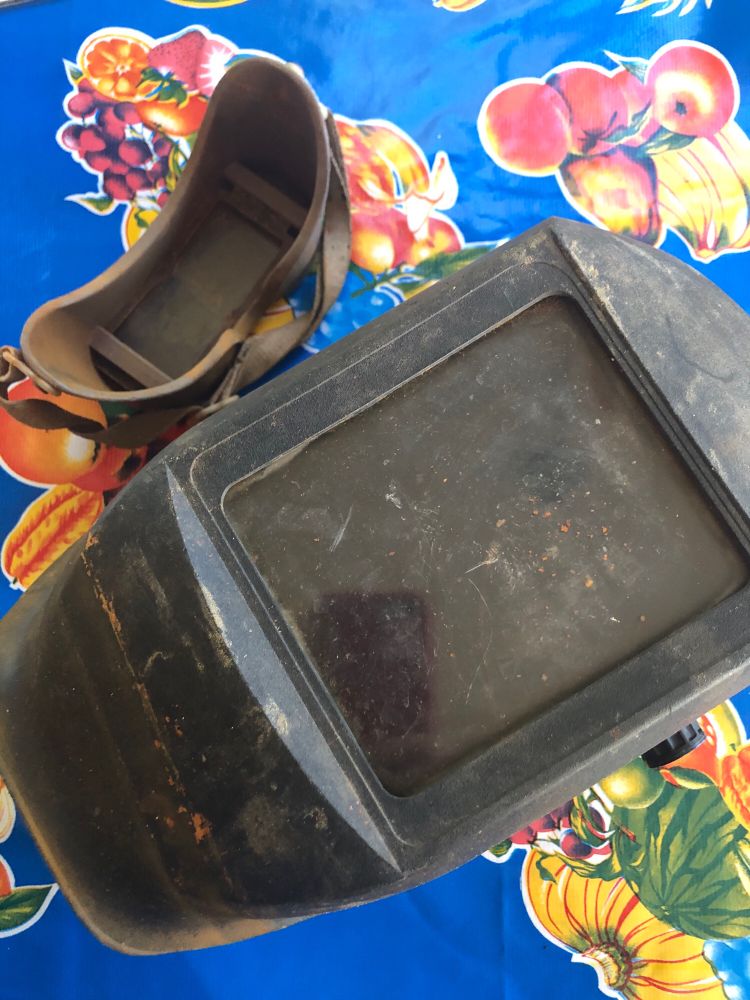 Photo of a welding helmet and goggles
