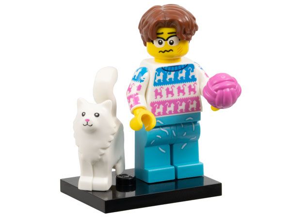 Lego minifigure "Cat Fan", a masc-appearing individual with a brown center part haircut, glasses, and a bright pink, white and blue sweater patterned with cats over top of a bright blue pair of pants
