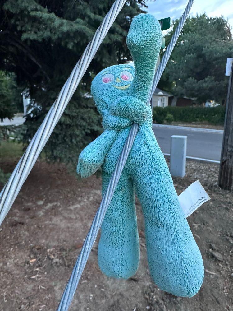 Gumby doll tied to a wire