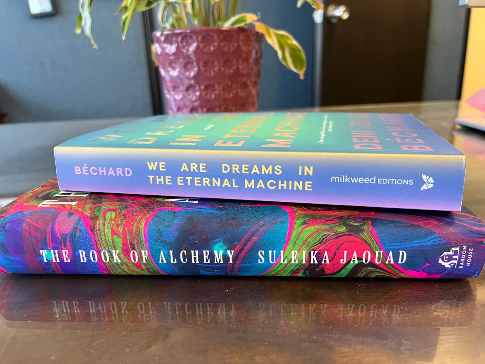 Two books pictured: The Book of Alchemy by Suleika Jaouad, and We Are Dreams in the Eternal Machine by Deni Ellis Béchard