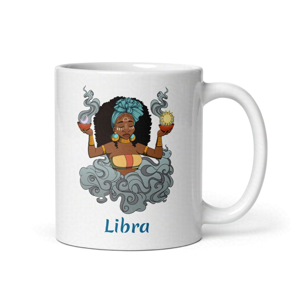 white ceramic mug with libra themed art 