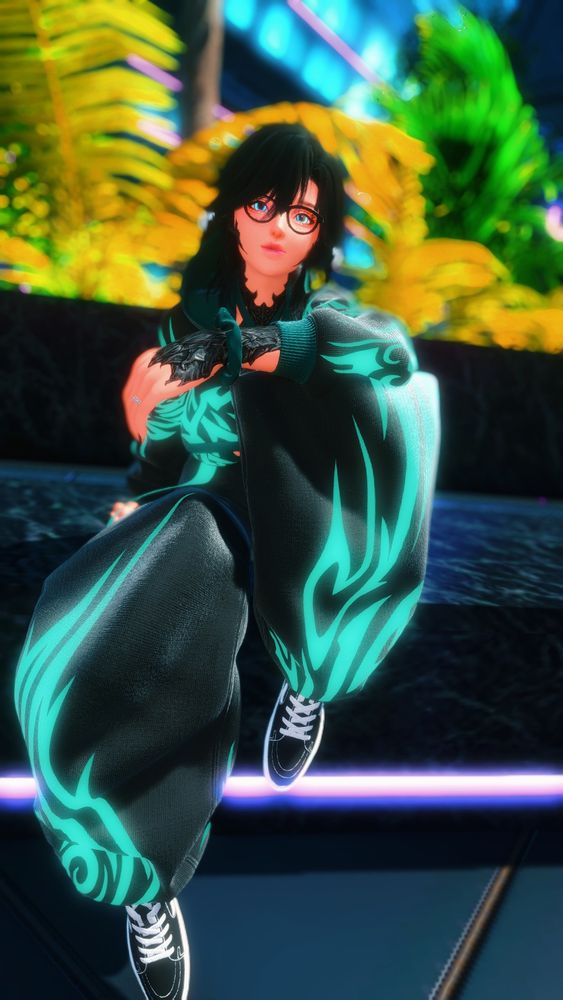 A small Au Ra woman with black scales and raven hair wearing glasses is sitting at a fountain, smiling.