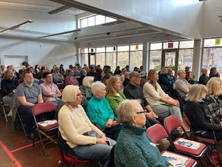 Crowd watching town hall