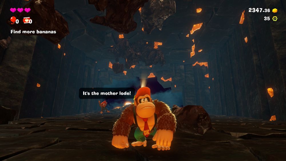 A screenshot from the game Donkey Kong Bananza. Donkey Kong is standing in an empty cave that used to be filled with gold. Not anymore!