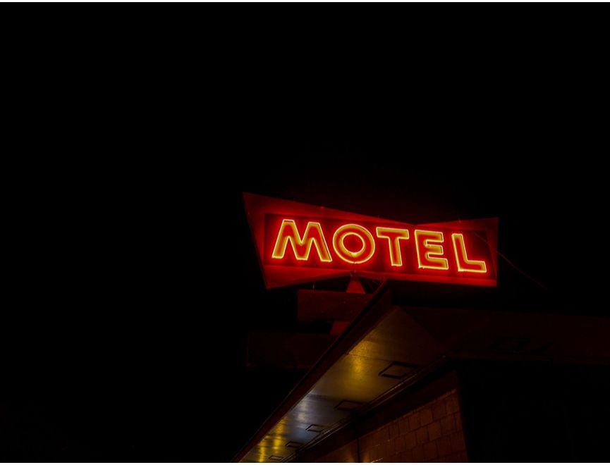 motel sign, retro neon, at night