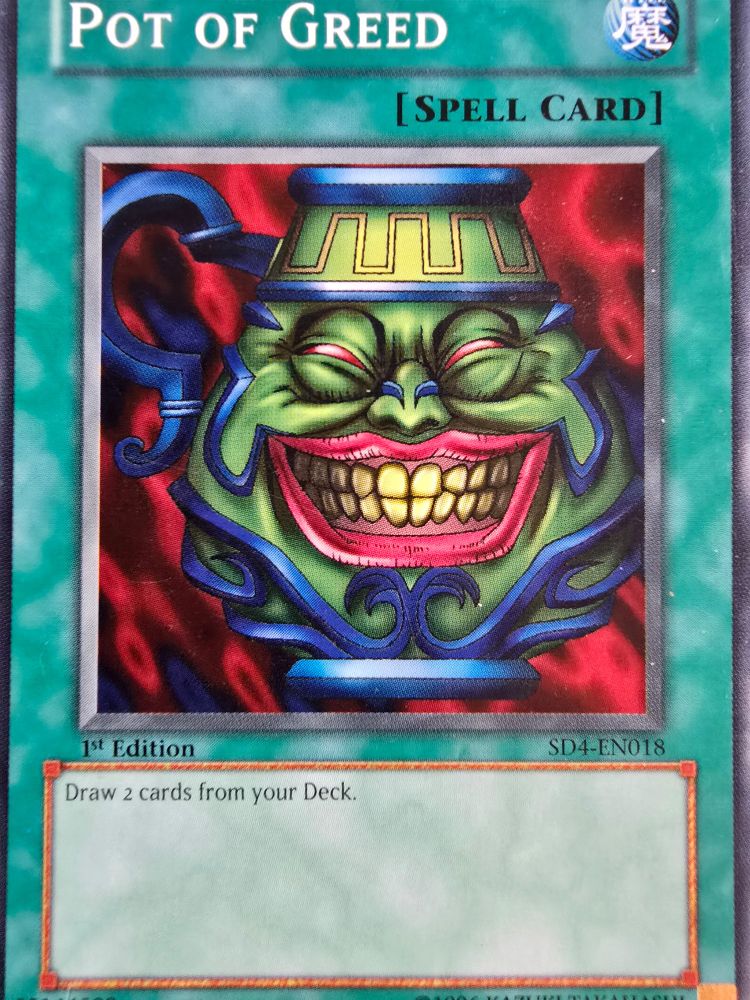Yu-Gi-Oh card "Pot of Greed"(spell card), depicts a large pot with a wide grinning face, eerily like JD Vance's AI images. The card reads "Draw 2 cards from your Deck"