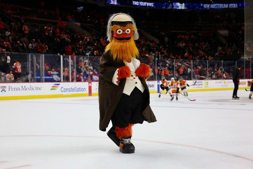 Philadelphia Flyers mascot Gritty dressed as Benjamin Franklin