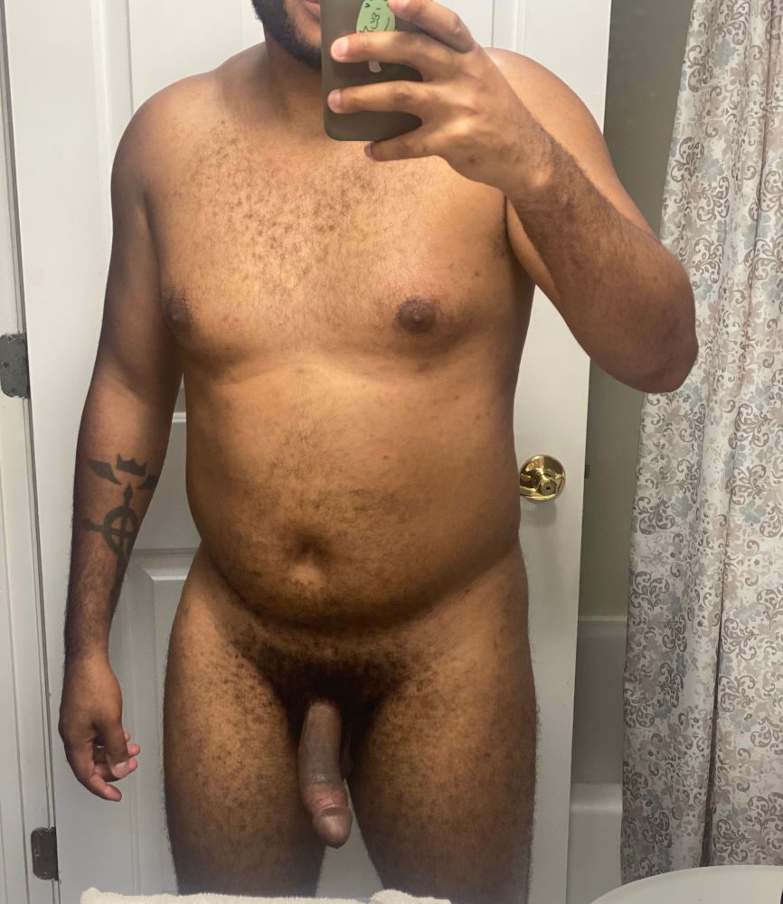Naked mirror selfie with phone in hand. 