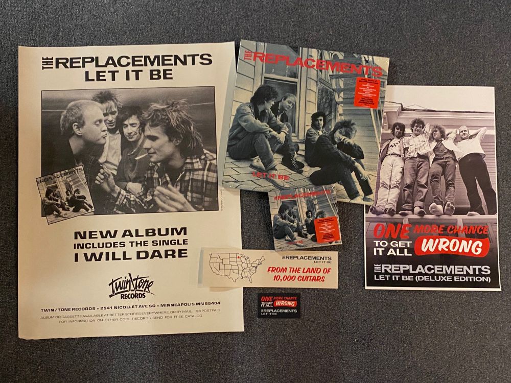 Pictured are two Replacements posters and two stickers and the new Let It Be deluxe vinyl and CD.