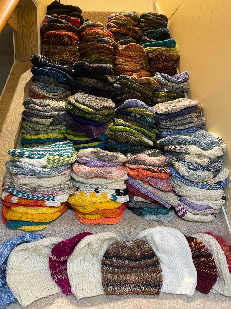 Stack of 289 hats to donate 