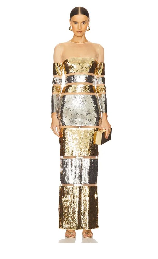 A sequined dress with silver and gold sections and gold bands, chosen to resemble the computer.