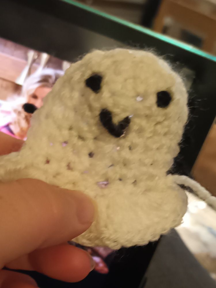 A small smiling crochet ghost.