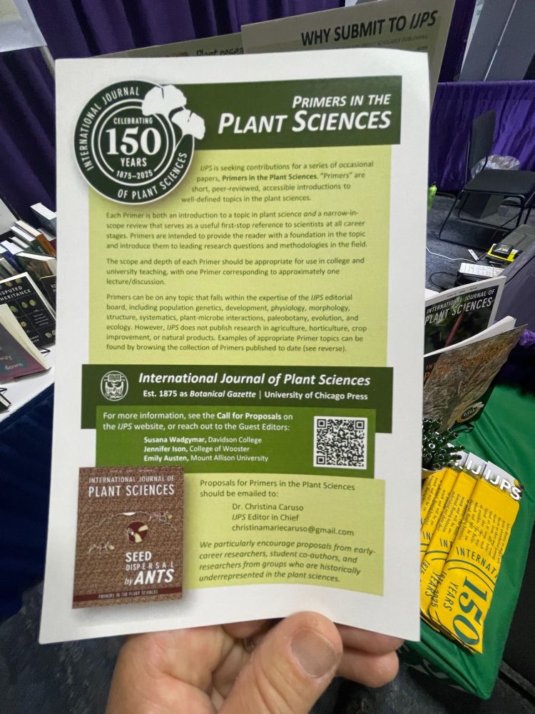 Hand holding flyer for Primers in the Plant Sciences.